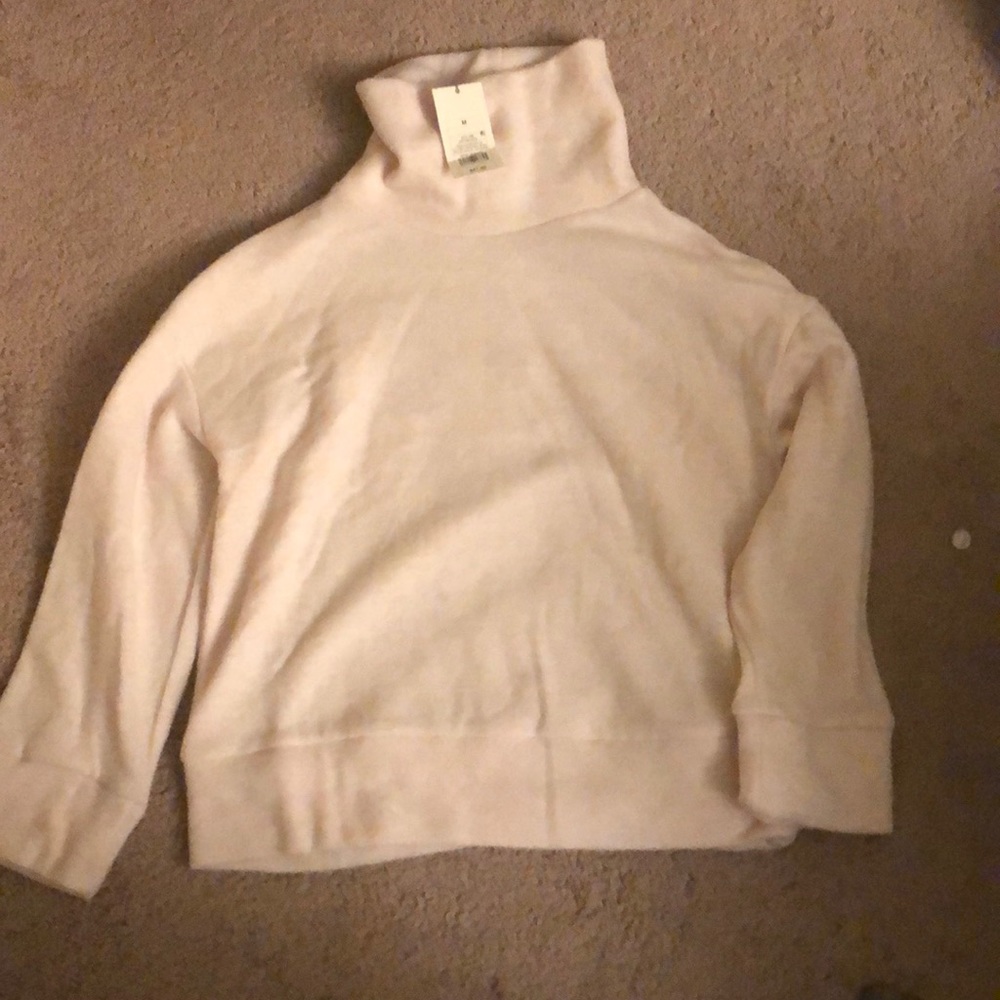 Pink sweater with a turtle neck